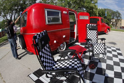 July 8, 2014 - 140708  -  Kelly Klick polishes her 1975 Boler camper Monday, July 8, 2014. The 1975 Boler camper is owned by  Kelly Klick and Tom McMahon and was restored by Kelly and her father Jack. John Woods / Winnipeg Free Press