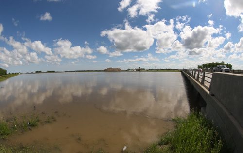 The Portage Diversion channel at maximum capacity Wednesday just west of Portage La Prairie, Manitoba   See Ashley Prest story- July 09, 2014   (JOE BRYKSA / WINNIPEG FREE PRESS)