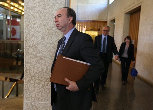City auditor Brian Whiteside leaves a meeting of Winnipeg city council on Wed., July 9, 2014, where members of the forensic auditing team that examined 33 real estate transactions explained and defended their report. Photo by Jason Halstead/Winnipeg Free Press