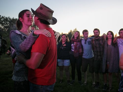 Mary Houston and Ian Naften share a moment in the crowd on opening night of Winnipeg Folk Fest 2014 at Birds Hill Park. 140709 - Wednesday, July 09, 2014 - (Melissa Tait / Winnipeg Free Press)