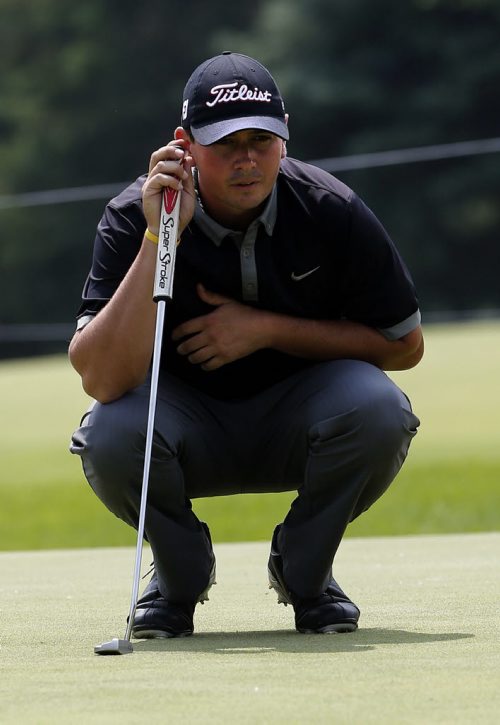 ,Joshua Creel lines up putt on 18 , he  is one of the leaders  on the first day of  The Players Cup at Pine Ridge July 10 2014 / KEN GIGLIOTTI / WINNIPEG FREE PRESS