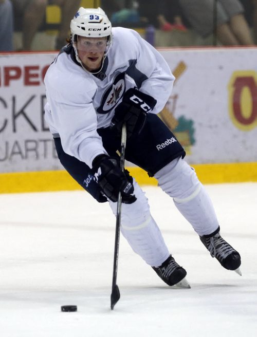 #93 Ben Walker carries puck over the blue line ,SPORTS . Winnipeg Jets Development Camp scrimmaged in front of a standing room  crowd at the MTS Iceplex   Story by Ed Tait . July 11 2014 / KEN GIGLIOTTI / WINNIPEG FREE PRESS