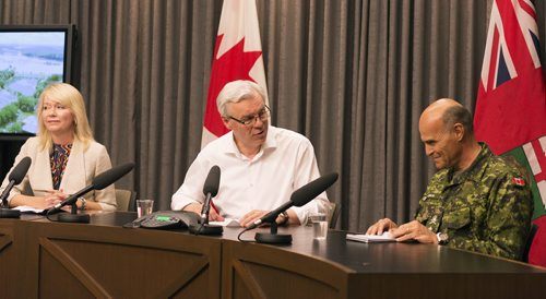 Premier Greg Selinger and MP Candace Bergen thank Brig.-Gen. Christian Juneau and the Canadian Forces for their assistance with the floods at the Legislative Building on Friday. Sarah Taylor / Winnipeg Free Press July 11, 2014