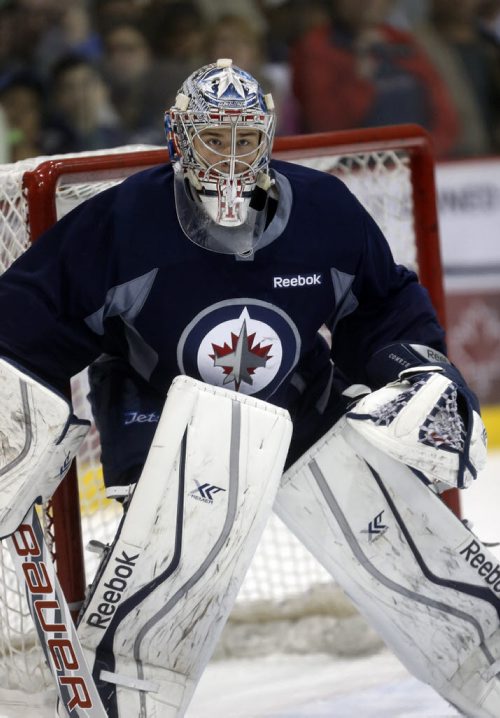 Goalie Eric Comrie in net .SPORTS - Winnipeg Jets Development Camp scrimmaged in front of a standing room  crowd at the MTS Iceplex   Story by Ed Tait . July 11 2014 / KEN GIGLIOTTI / WINNIPEG FREE PRESS