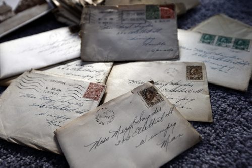 Lori and Darrell Dustin discovered a hundred , century old love letters hidden in the floor boards of their home during a renovation . The letters are from a WW1 soldier to his girl friend in Wpg . Sinclair story .  July 11 2014 / KEN GIGLIOTTI / WINNIPEG FREE PRESS