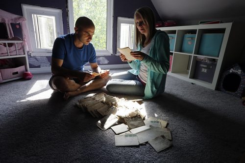 Lori and Darrell Dustin discovered a hundred , century old love letters hidden in the floor boards of their home during a renovation . The letters are from a WW1 soldier to his girl friend in Wpg . Sinclair story .  July 11 2014 / KEN GIGLIOTTI / WINNIPEG FREE PRESS