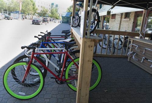 University of Manitoba business student Brendan McAndrew has opened a bike rental and retail store at Forks Public Market for the summer. Sarah Taylor / Winnipeg Free Press July 11, 2014