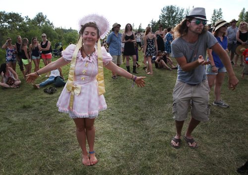 Sara Yabelniski, left, from Russell, Manitoba has some fun dancing at the Winnipeg Folk Festival Main Stage friday night in Birds Hill Park-See Jen Zoratti story- July 11, 2014   (JOE BRYKSA / WINNIPEG FREE PRESS)