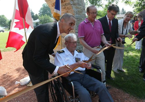 A plague honouring a group of 7 local, Arden Ave. war vets is part of a park plaza in St. Vital that was officially opened Saturday at a ribbon cutting ceremony.  George Peterson, the last surviving member of the group of seven war veterans from the Battle of Hong Kong was honoured  at the new Jules Mager Park with Mayor Sam Katz,  Minister Kevin Chief and St. Vital Councillor Brian Brian Mayes in attendance.  See Ashley Prest story. July 12, 2014 Ruth Bonneville / Winnipeg Free Press