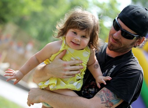 REGGAE FEST - Two-year-old Athena Billingsley loves dancing and hanging out with her dad--Chris as they attend  the Soca Reggae Festival in Old Market Square Saturday afternoon.  The event  features hypnotic reggae acts, spicy Caribbean delicacies, crafts and a beverage garden and runs till late evening Saturday.  Standup photo  July 12, 2014 Ruth Bonneville / Winnipeg Free Press