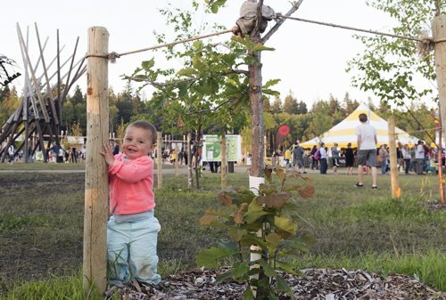 Kymera Wylder, 11 months, and her family attend Folk Fest from British Columbia. Her mother is working at one of the festivals vendors. Sarah Taylor / Winnipeg Free Press July 12, 2014
