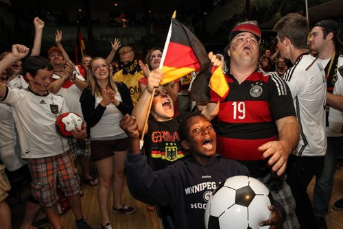 Fans celebrate Germany's World Cup win over Argentina at the Germany Club on Flora Ave Sunday afternoon.  140713 - Sunday, July 13, 2014 -  (MIKE DEAL / WINNIPEG FREE PRESS)