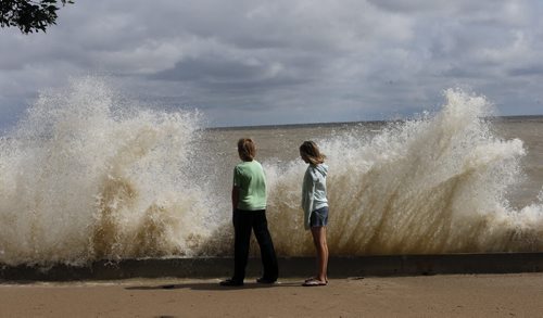 LOCAL Prov. Camryn Myshkowsky   and Tyson Groots  get veiw of crashing waves that flooded the beach  from atop the breakwall  and raised shore line  bike path and boardwalk  , as visitors  and locals arrive to watch the water at  Winnipeg Beach. High winds cause water to  crash over the break wall at boardwalk and bike path , the boardwalk is closed due to a high water and wind advisory. Winnipeg Beach Mayor Tony Pimentel says Boardwalk Days are still on . Our annual summer festival returns for another year featuring a HUGE midway by Wondershows, an outdoor craft & vendor market under a tent, pancake breakfast, parade and FIREWORKS. Wonder Shows Friday 5-11pm Saturday noon-11pm Sunday noon-5pm Outdoor Market Friday 5-11pm Saturday noon-11pm Sunday noon-5pm Parade Saturday 11am from Prospect & Maple to downtown Big Slick & Whole Lotta Angus Saturday 7pm on the Bandstand Fireworks Saturday @ dusk Pancake Breakfast & Fire Department Open House Sunday 8-noon at the Fire Hall- story by Adam Wazny  July 14 2014 / KEN GIGLIOTTI / WINNIPEG FREE PRESS