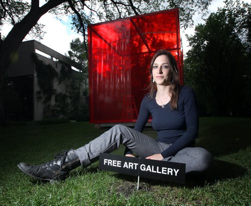 Fine arts grad and architecture student Elyssa Stelman beside pop up art gallery "the little red art gallery" which has it's opening this evening. See GOrd Sinclair's story. July 14, 2014 - (Phil Hossack / Winnipeg Free Press)