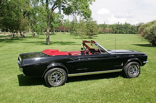 BORIS MINKEVICH / WINNIPEG FREE PRESS  070708 Louis Grimaud has a black '67 Mustang convertible, 57,000 original miles on it.  Car was in storage from Sept. 86 to Aug. 2006. The 289 V8 has had a full rebuild with many performance parts.