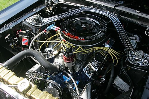 BORIS MINKEVICH / WINNIPEG FREE PRESS 070708 Louis Grimaud has a black '67 Mustang convertible, 57,000 original miles on it. Car was in storage from Sept. 86 to Aug. 2006. The 289 V8 has had a full rebuild with many performance parts.
