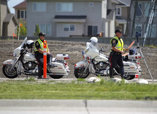 LOCAL/STANDUP - SLOOOOOOOOW DOWN - Winnipeg Police Service enforce construction speed zone on Kenaston Blvd. . BORIS MINKEVICH / WINNIPEG FREE PRESS  July 15, 2014