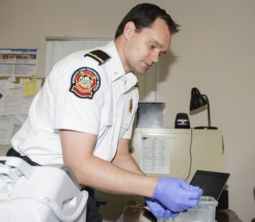 Paramedic Ryan Sheath, 33, has won the award of excellence for innovative technology for his work with HIV testing and treating at Main Street Project on Martha Street. Sarah Taylor / Winnipeg Free Press July 15, 2014