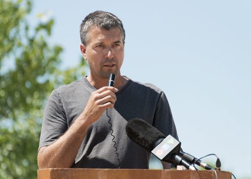 Mark Peters speaks at his farm north of Portage La Prairie where residents and farmers gather to build a channel out of Lake Manitoba to prevent damage to their land. on Tuesday. Sarah Taylor / Winnipeg Free Press July 15, 2014