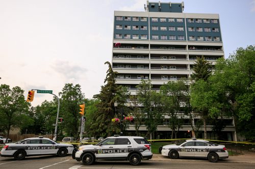 Police response, including tactical support team, at 195 Young St at the corner of Broadway early Wedneday evening. 140716 - Wednesday, July 16, 2014 - (Melissa Tait / Winnipeg Free Press)