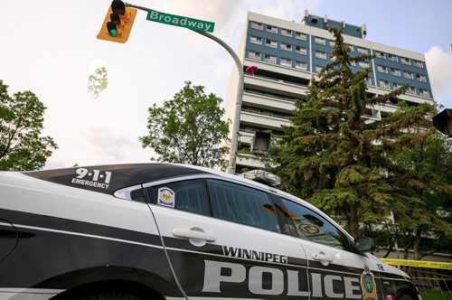 Police response, including tactical support team, at 195 Young St at the corner of Broadway early Wedneday evening. 140716 - Wednesday, July 16, 2014 - (Melissa Tait / Winnipeg Free Press)
