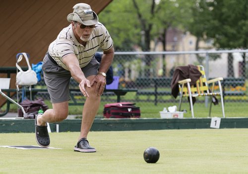 Terry Horsman plays lawn bowling at St. John's park on Wednesday evening. Sarah Taylor / Winnipeg Free Press July 16, 2014