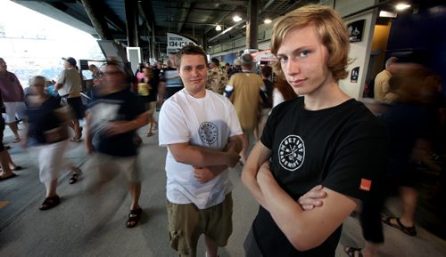 Ben Boxall, 16 and Zachery Boyar pose at the Winnipeg Blue Bomber game Thursday. A group of teens are going to various events around town and using social media to tell others about their experiences and encourage other teens to literally get out of the basement. July 17, 2014 - (Phil Hossack / Winnipeg Free Press)