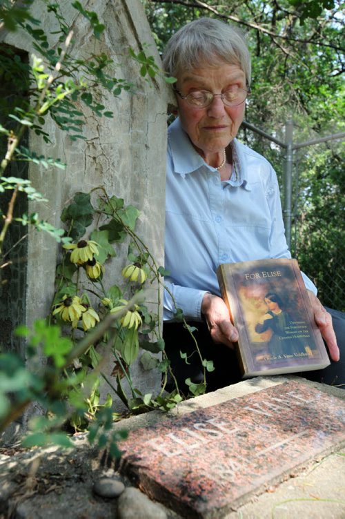 Oriole Vane Veldhuis holds her book next to her great- grandmother's grave Else.  Oriole Vane Veldhuis, author of For Elise, who has rescurrected the Criddle - Vane story with her research and depiction of Criddle's mistress Else Vane who was actually engaged to Criddle for  but who he never married.  49er feature on the Criddle family the park is named after. Percy Criddle, a somewhat wealthy merchant, arrived from London in 1882 with his wife and four children, and his German mistress Else and their five children.  They homesteaded in this weird arrangement, passing off his mistress as a widow who worked as the family maid. The provincial park still carries many of their effects, although vandals torched the home  about two weeks ago. Homestead is near Shilo Manitoba.  See Bill Redekop story.   July 16, 2014 Ruth Bonneville / Winnipeg Free Press