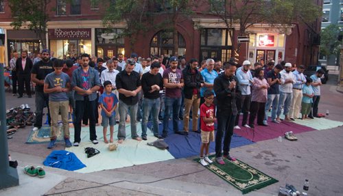 JOHN JOHNSTON / WINNIPEG FREE PRESS  Social Page for July 19th, 2014  A group of Muslims praying at sunset at the outdoor event.