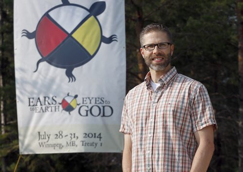 Faith . Wpg Mennonites host North American Native assembly , Ears to Earth , Eyes to God July 28 to 31 . Steve Heinrich  is one of the planners with banner . story by Brenda Suderman . July 18 2014 / KEN GIGLIOTTI / WINNIPEG FREE PRESS