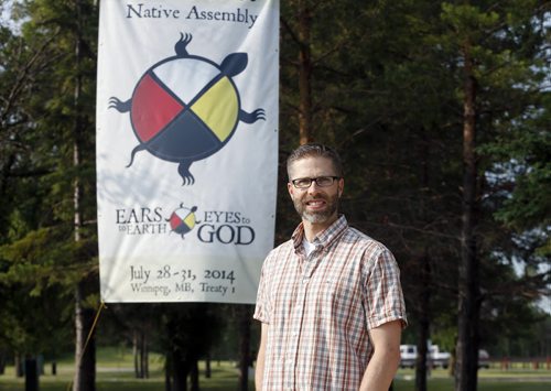 Faith . Wpg Mennonites host North American Native assembly , Ears to Earth , Eyes to God July 28-31 . Steve Heinrich  is one of the planners with banner . story by Brenda Suderman . July 18 2014 / KEN GIGLIOTTI / WINNIPEG FREE PRESS