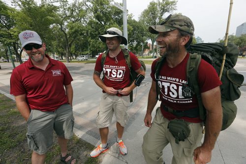 MARCHING FOR PTSD Äî Three former Canadian soldiers and veterans of the Croatian peacekeeping mission are going to march across Canada to bring awareness to Post Traumatic Stress Disorder (PTSD). They arrived in  Winnipeg late Friday noon .LtoR , Scott McFarlane ,  Jason McKenzie  and Steve Hartwig march to the Mb Legislature  . July 18 2014 / KEN GIGLIOTTI / WINNIPEG FREE PRESS