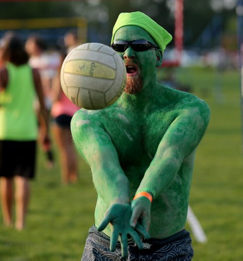 Darryl Shotton of the Midaged Mutant Ninja Turtles warming up at the Super-Spike volleyball tournament at Maple Grove Rugby Park, Friday, July 18, 2014. (TREVOR HAGAN/WINNIPEG FREE PRESS)
