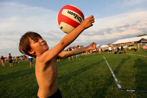 Alexander Schinkel, 3, playing with a ball at the Super-Spike volleyball tournament at Maple Grove Rugby Park, Friday, July 18, 2014. (TREVOR HAGAN/WINNIPEG FREE PRESS)