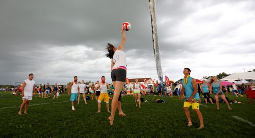 Kristin Robson of Interracial Sets hits the ball during her teams game against Dirty By Day, Electric By Night, at the Super-Spike volleyball tournament at Maple Grove Rugby Park, Friday, July 18, 2014. (TREVOR HAGAN/WINNIPEG FREE PRESS)