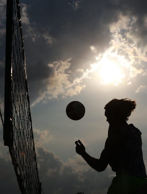 A member of Back That Pass Up hits the ball during the Super-Spike volleyball tournament at Maple Grove Rugby Park, Friday, July 18, 2014. (TREVOR HAGAN/WINNIPEG FREE PRESS)