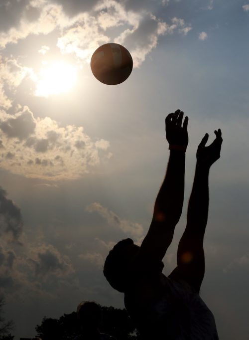 A member of Back That Pass Up bumps the ball during the Super-Spike volleyball tournament at Maple Grove Rugby Park, Friday, July 18, 2014. (TREVOR HAGAN/WINNIPEG FREE PRESS)