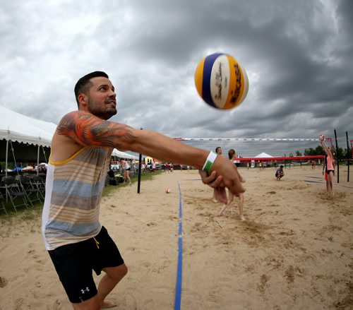 Marcus Gallant of City Kitties warms up at the Super-Spike volleyball tournament at Maple Grove Rugby Park, Friday, July 18, 2014. (TREVOR HAGAN/WINNIPEG FREE PRESS)