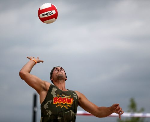 Brian Sterzer of team Boom! serves the bal during the Super-Spike volleyball tournament at Maple Grove Rugby Park, Friday, July 18, 2014. (TREVOR HAGAN/WINNIPEG FREE PRESS)