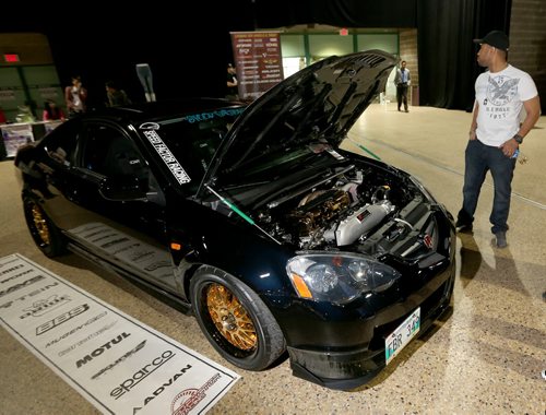 An Acura RSX with 24k gold plated wheels and valve cover, at Winnipeg Speed Fest at the Winnipeg Convention Centre, Saturday, July 19, 2014. (TREVOR HAGAN/WINNIPEG FREE PRESS)