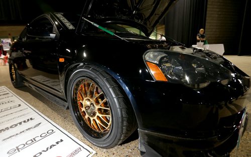 An Acura RSX with 24k gold plated wheels and valve cover, at Winnipeg Speed Fest at the Winnipeg Convention Centre, Saturday, July 19, 2014. (TREVOR HAGAN/WINNIPEG FREE PRESS)