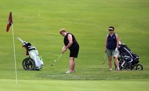 Golfers on the 9th hole at the Wildwood Club, Sunday, July 20, 2014. (TREVOR HAGAN/WINNIPEG FREE PRESS)