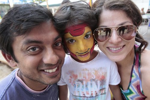 July 20, 2014 - 140720  -  Sahil Kibria shows off his new face painting with his dad Sami and mom Kavita at The Winnipeg Fringe Festival Sunday, July 20, 2014. John Woods / Winnipeg Free Press