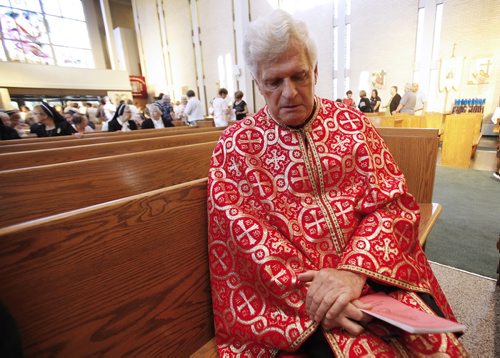 July 20, 2014 - 140720  -  Right Reverend Monseigneur Michael Buyachok reflects during an interview after a memorial service at St Joseph Ukrainian Catholic Church Sunday, July 20, 2014 for victims of Malaysian flight MH17 which was allegedly shoot down over the Ukraine. John Woods / Winnipeg Free Press