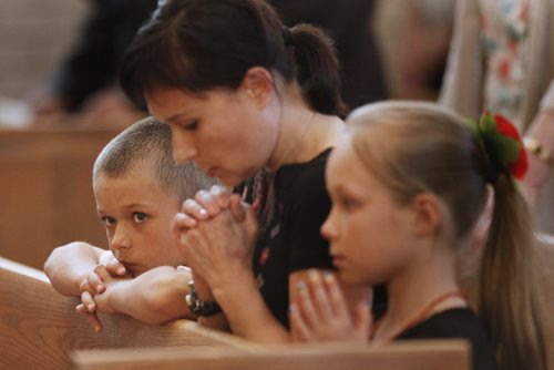 July 20, 2014 - 140720  -  People attend a memorial service at St Joseph Ukrainian Catholic Church Sunday, July 20, 2014 for victims of Malaysian flight MH17 which was allegedly shoot down over the Ukraine. John Woods / Winnipeg Free Press