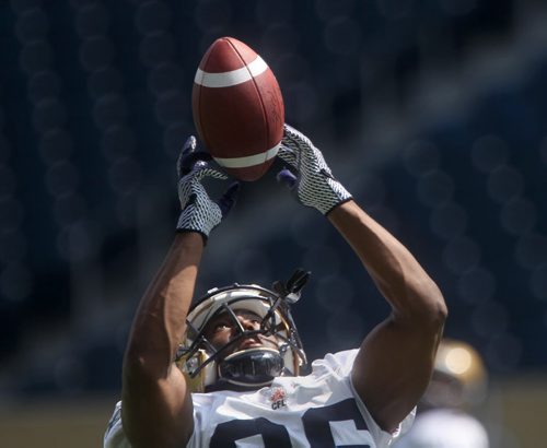 Winnipeg Blue Bomber practice roster player Donavon Kemp keeps his eye on the ball during practice Monday afternoon at Investors Group Field-See Ed Tait Story- July 21, 2014   (JOE BRYKSA / WINNIPEG FREE PRESS)
