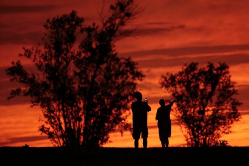 July 21, 2014 - 140721  -  A couple enjoys a sunset over Winnipeg from Westview Park, a.k.a. "Garbage Hill" Monday, July 21, 2014.  John Woods / Winnipeg Free Press