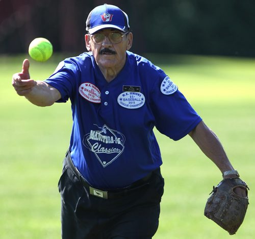 Bill Petrishen a pitcher with the Manitoba 55 + Classics league enjoys some softball with some friends in Kildonan Park Tuesday morning- in Aug, Petrishen will be 80 years old.  Standup Photo- July 22, 2014   (JOE BRYKSA / WINNIPEG FREE PRESS)
