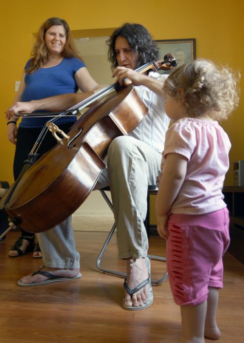 Recent Greek immigrants Stefanos Boukis, his wife Lia Andronikou and their daughter Danai Bouki with their fathers antique cello in their West end home -See Carol Sanders Story- July 22, 2014   (JOE BRYKSA / WINNIPEG FREE PRESS) ( Eds Tyler is preparing a small Blippar video of one of their recent concerts)