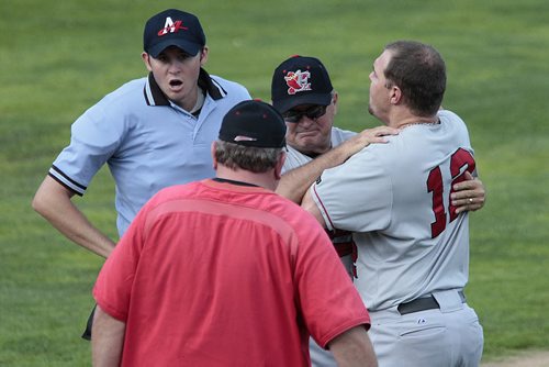 July 22, 2014 - 140722  -  Fargo-Moorhead RedHawks CJ Retherford (12) has to be held back from the umpire after being called out against the Winnipeg Goldeyes in Winnipeg Tuesday, July 22, 2014.  John Woods / Winnipeg Free Press